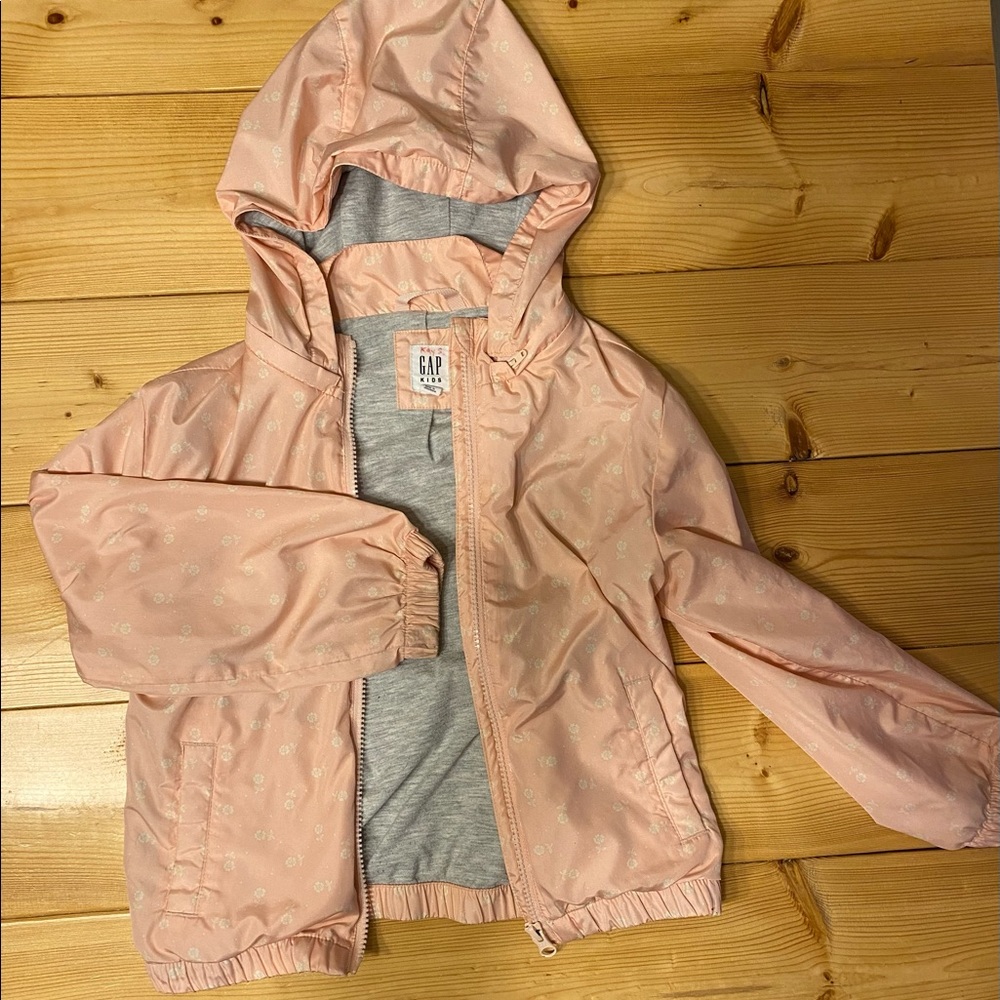 Girls GAP raincoat. Size small. Pink with white flowers.